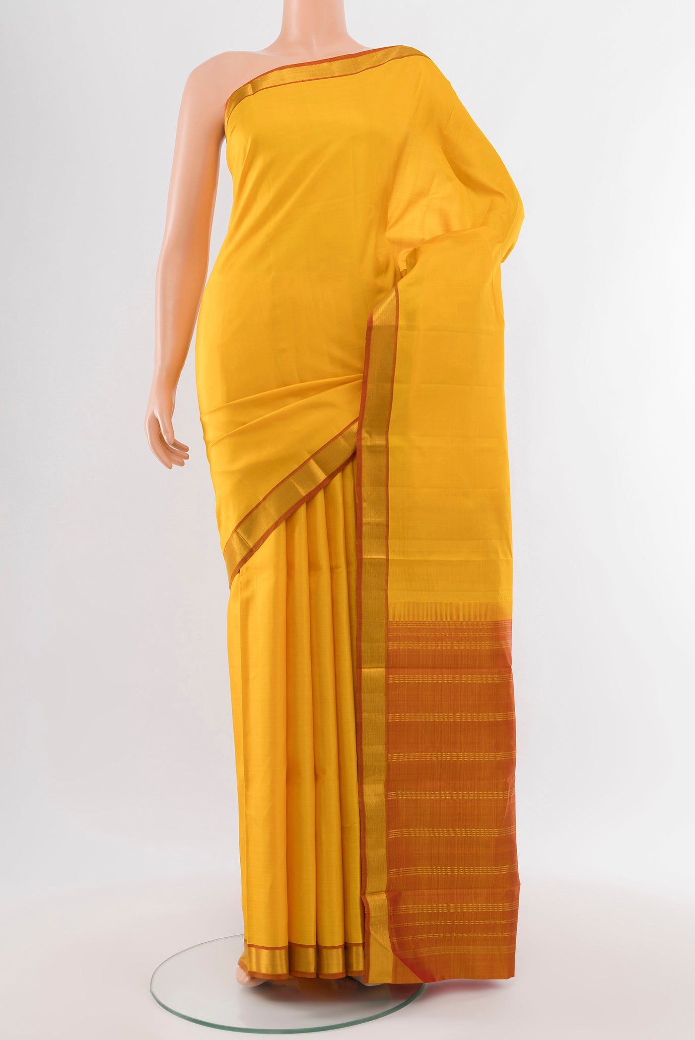 Pure Silk Pure Zari Yellow Kanjivaram Saree with Plain Body and Silk Border.  displayed on a mannequin