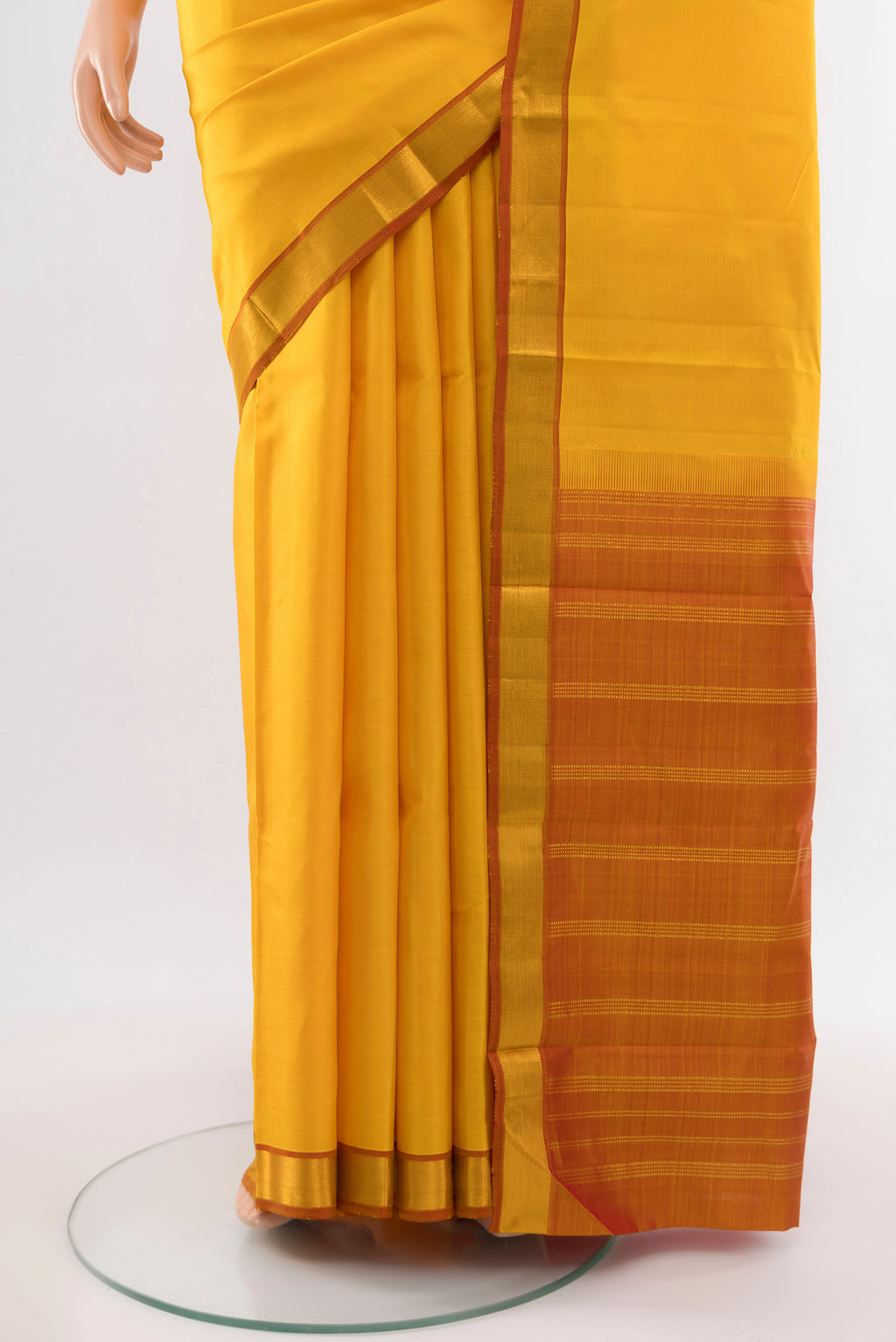 Pleats and pallu of Pure Silk Pure Zari Yellow Kanjivaram Saree with Plain Body and Silk Border. 