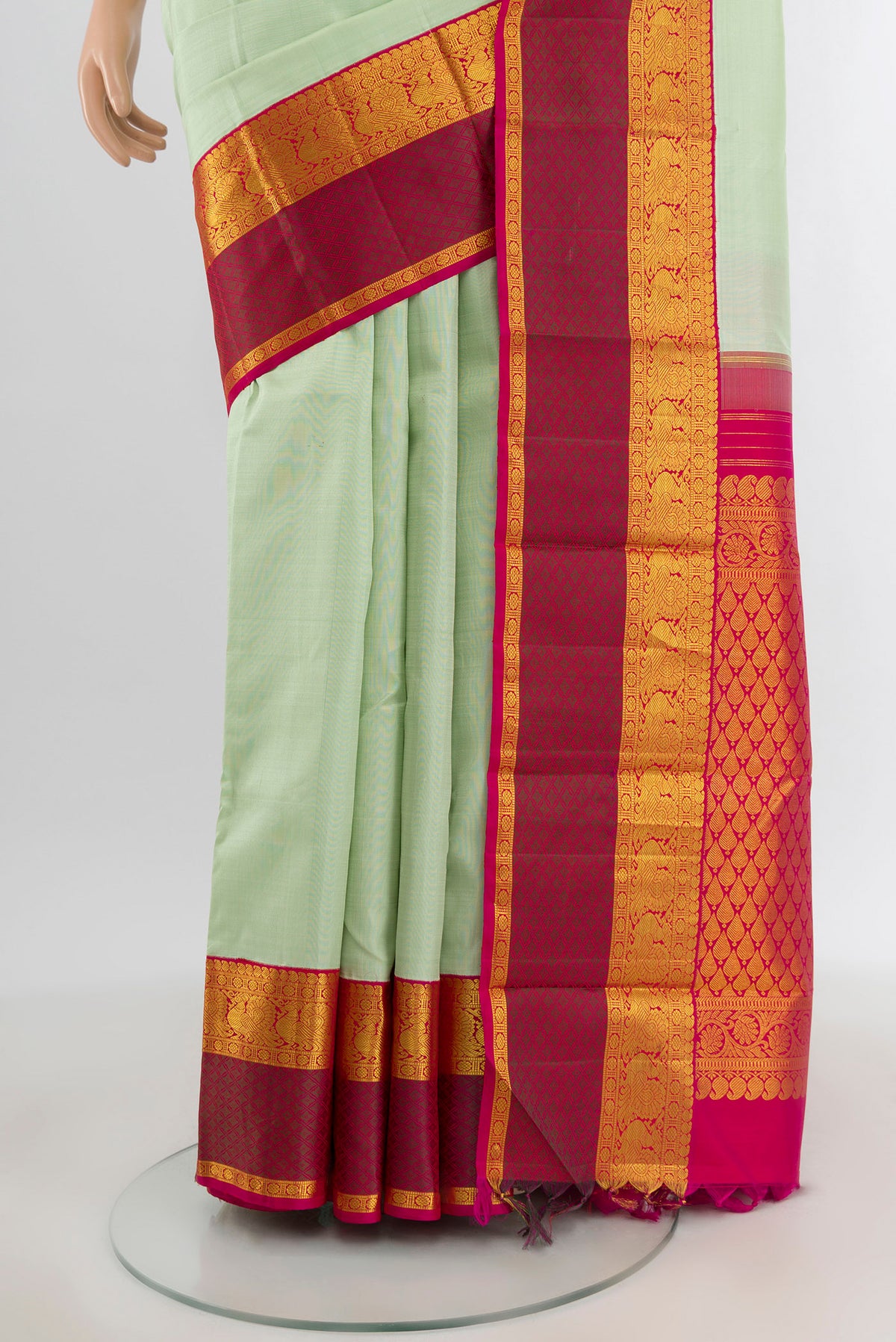 Pleats and pallu of Pista Green Kanjivaram Silk Saree with Plain Body and Zari Border. 