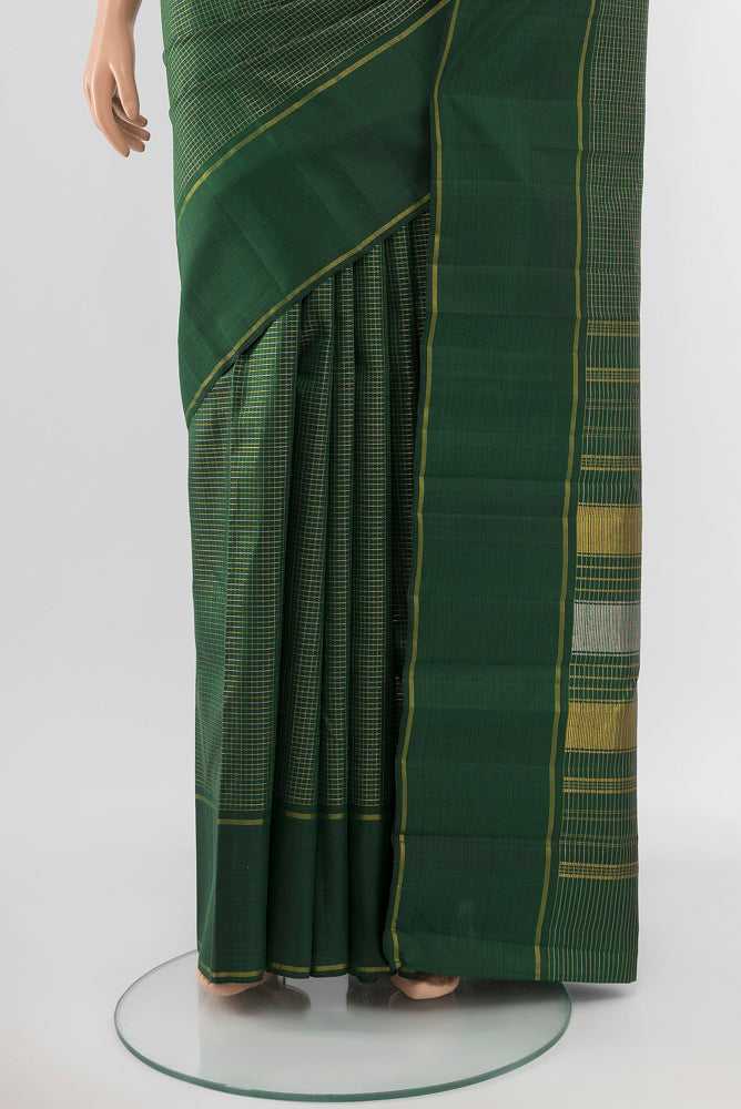 Pleats and pallu of Bottle Green Kanchipuram Silk Saree with Zari Butta on the body and Silk Border. 