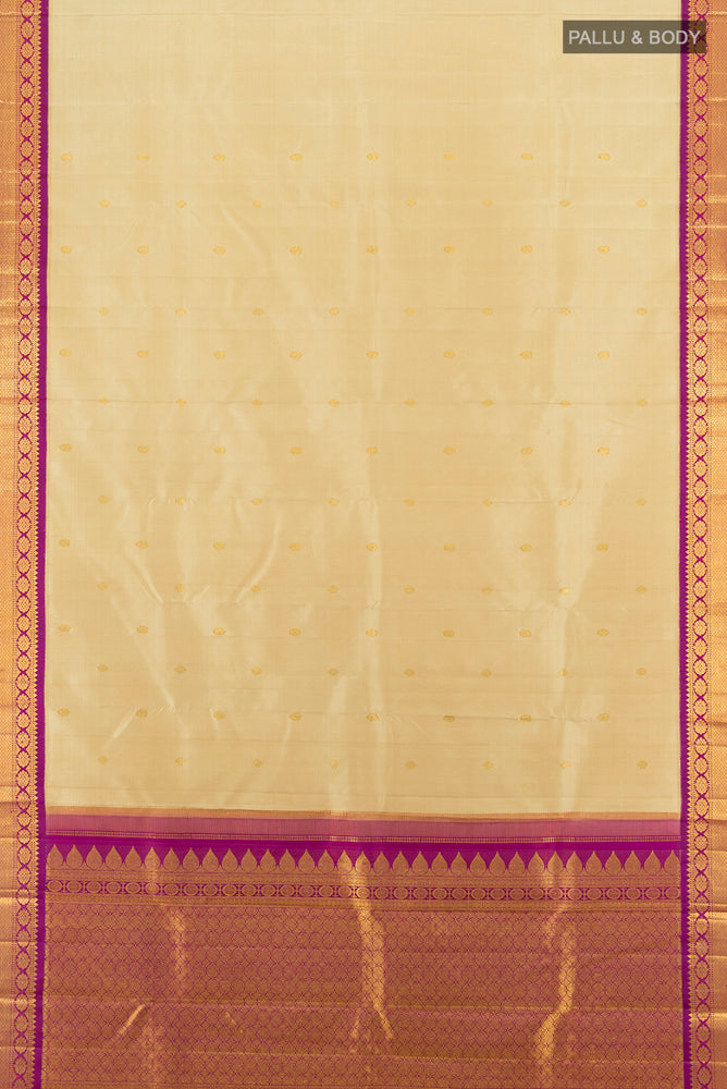 Flat view of Beige Kanchipuram Silk Saree with Zari Butta on the body and Silk Border. 