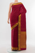 Pure Silk Pure Zari Maroon Kanchipuram Saree with Zari Butta on the body and Silk Border.  displayed on a mannequin