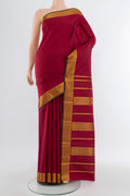 Maroon Kanchipuram Silk Saree with Plain Body and Silk Border.  displayed on a mannequin