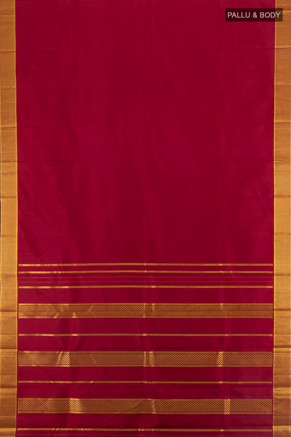 Flat view of Maroon Kanchipuram Silk Saree with Plain Body and Silk Border. 