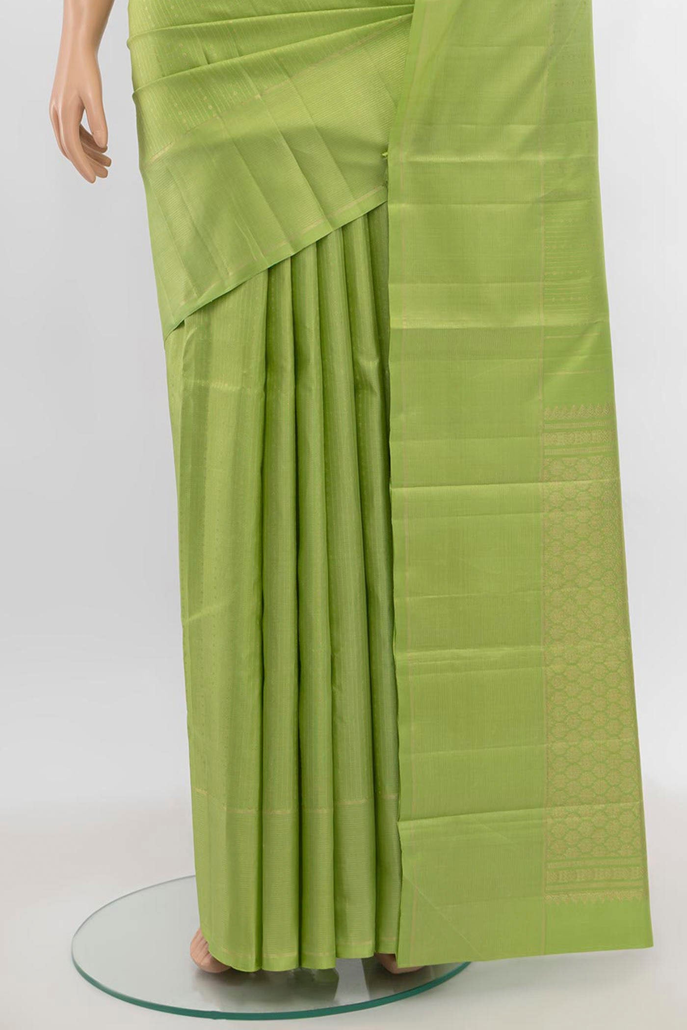 Pleats and pallu of Pista Green Kanchipuram Silk Saree with Zari Butta on the body and Silk Border. 