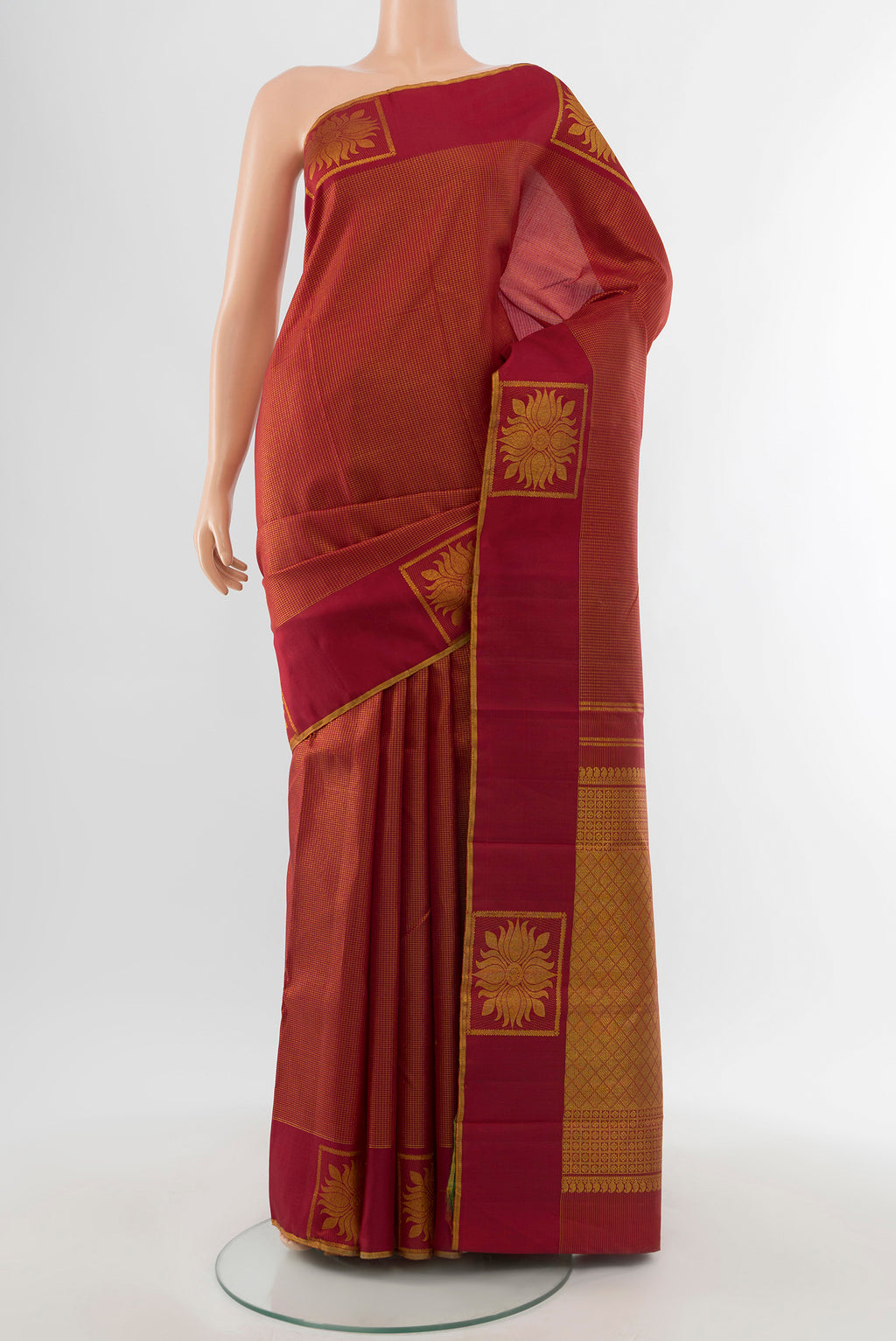 Maroon Kanjivaram Silk Saree with Checked design on the body and Fancy Border.  displayed on a mannequin