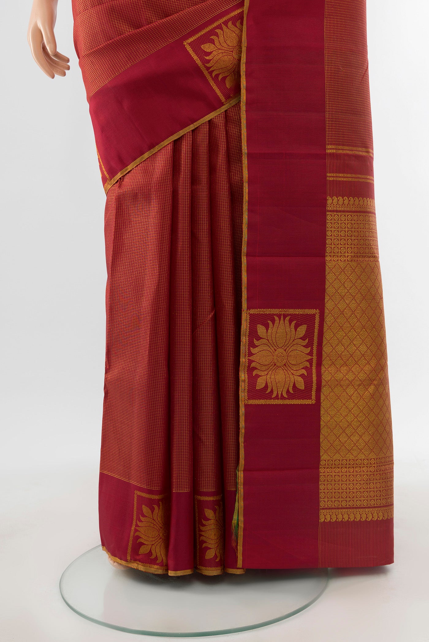 Pleats and pallu of Maroon Kanjivaram Silk Saree with Checked design on the body and Fancy Border. 