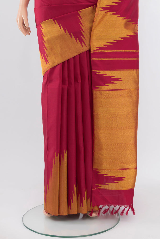 Pleats and pallu of Pure Silk Pure Zari Maroon Kanjivaram Saree with Zari Butta on the body and Silk Border. 