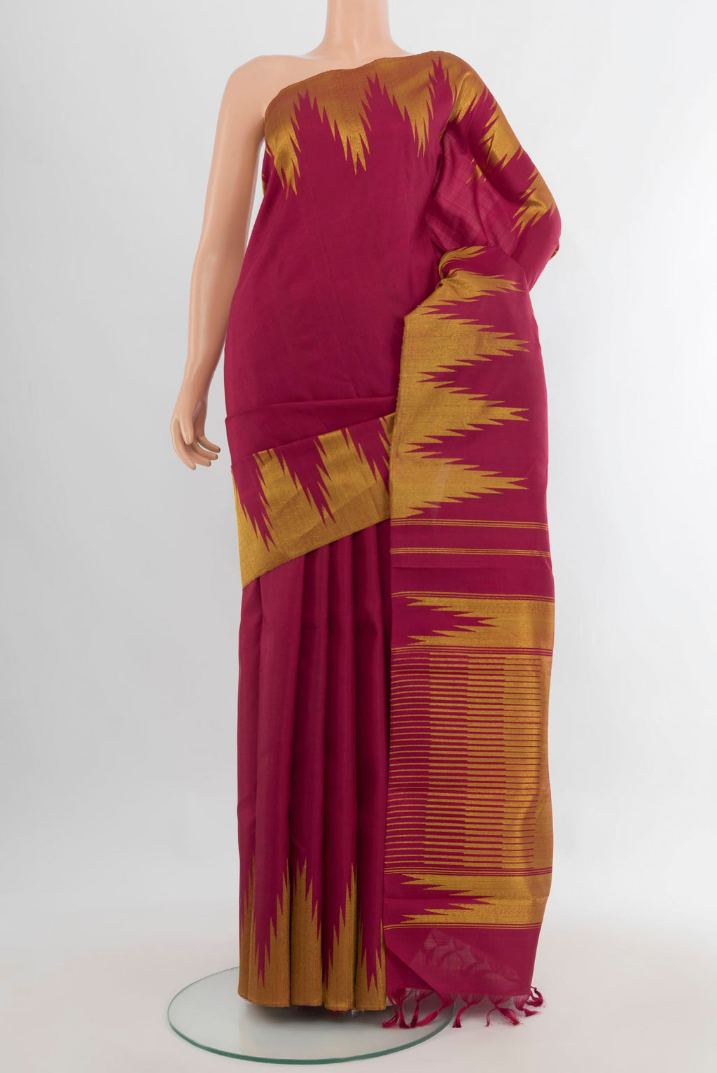 Pure Silk Maroon Kanjivaram Saree with Plain Body and Temple Border.  displayed on a mannequin