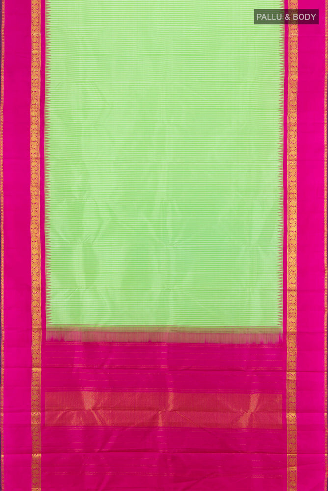 Flat view of Light Green Kanjivaram Silk Saree with Zari Butta on the body and Silk Border. 
