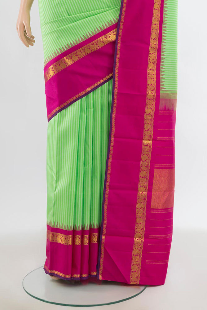 Pleats and pallu of Light Green Kanjivaram Silk Saree with Zari Butta on the body and Silk Border. 