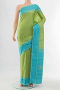 Pista Green Kanchipuram Silk Saree with Zari Butta on the body and Silk Border displayed on a mannequin