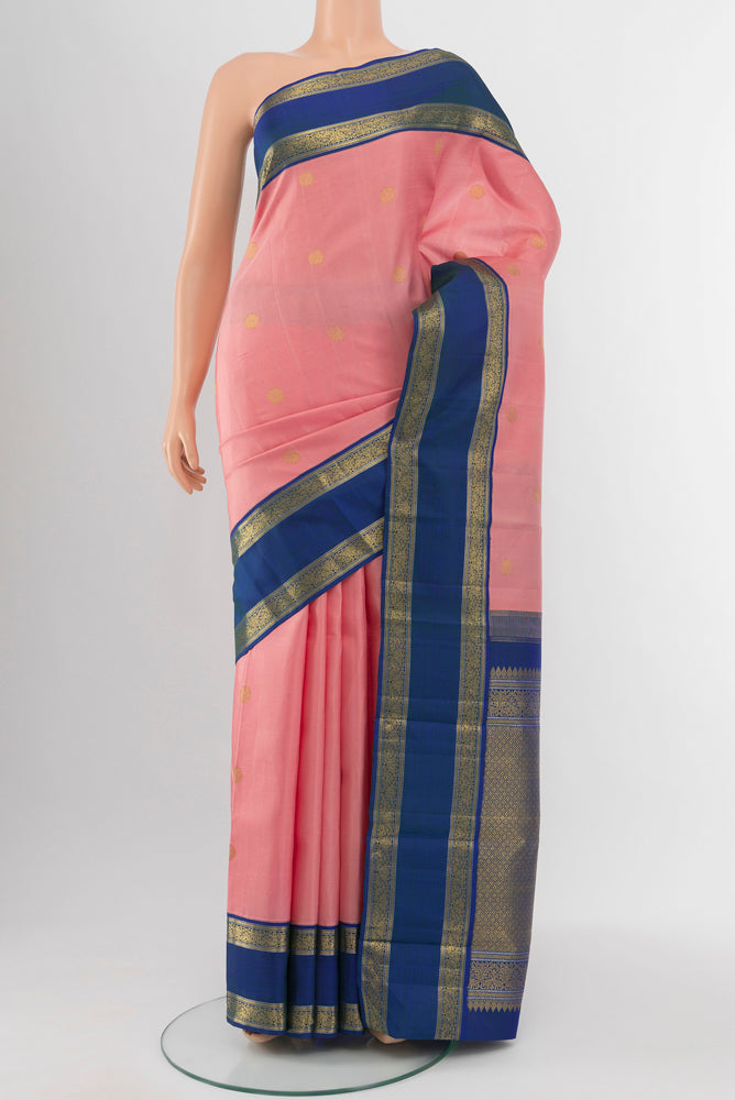 Rose pink Kanchipuram Silk Saree with Zari Butta on the body and Silk Border.  displayed on a mannequin