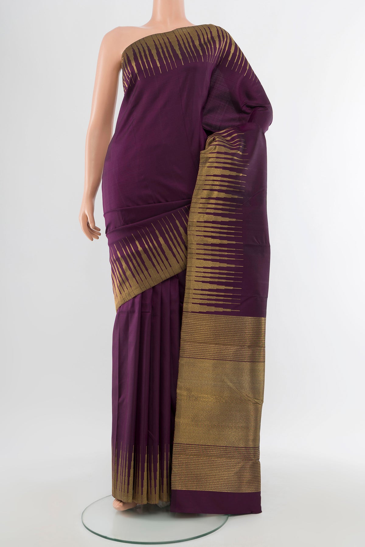 Pure Silk Pure Zari Violet Kanchipuram Saree with Zari Butta on the body and Silk Border.  displayed on a mannequin