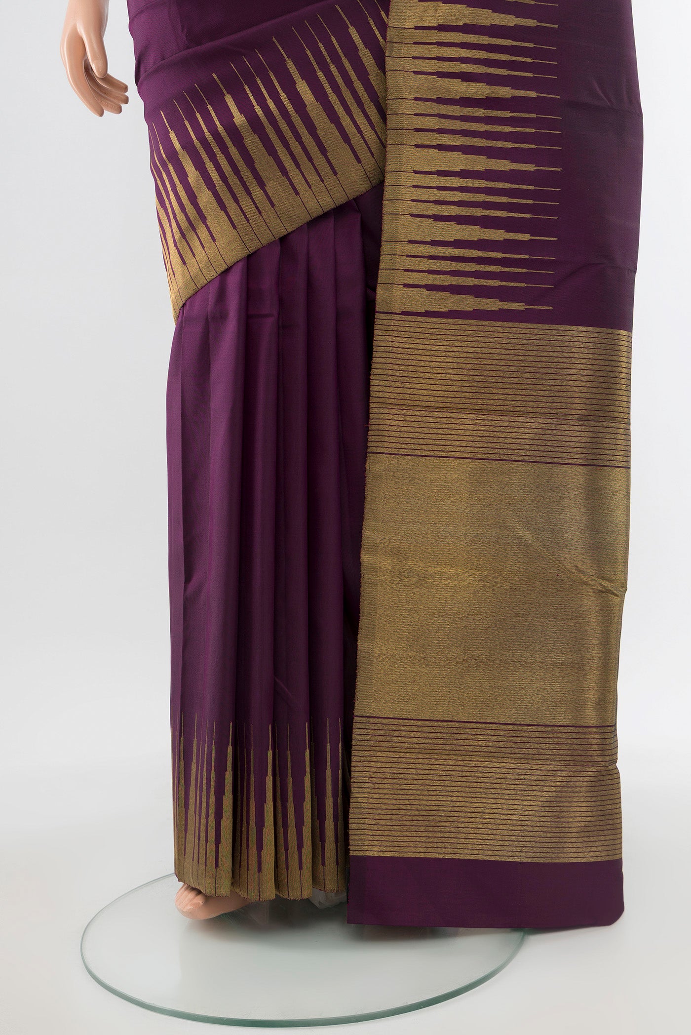 Pleats and pallu of Pure Silk Pure Zari Violet Kanchipuram Saree with Zari Butta on the body and Silk Border. 