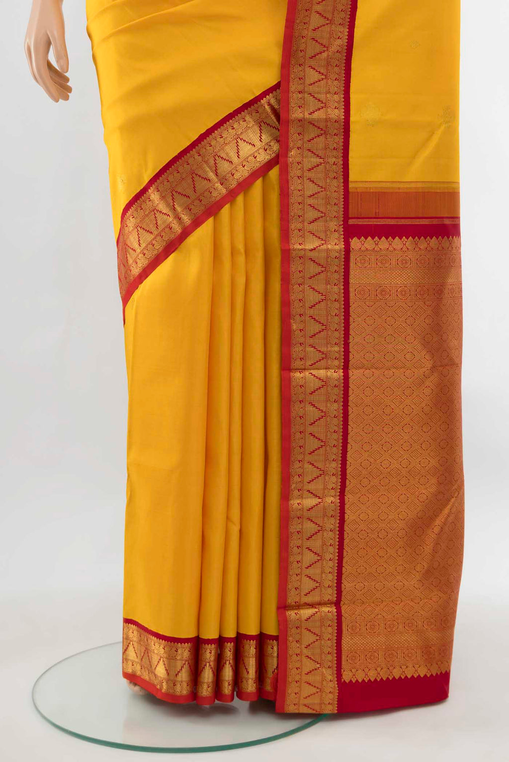 Pleats and pallu of Pure Silk Pure Zari Yellow Kanjivaram Saree with Zari Butta on the body and Silk Border. 