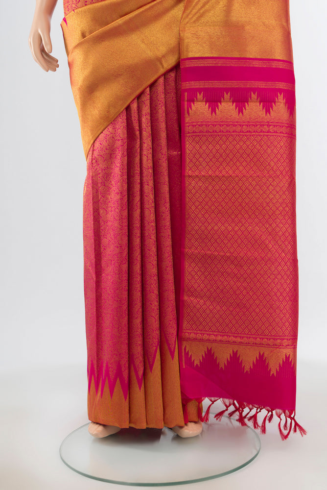 Pleats and pallu of Golden Kanchipuram Silk Saree with Zari Butta on the body and Silk Border. 