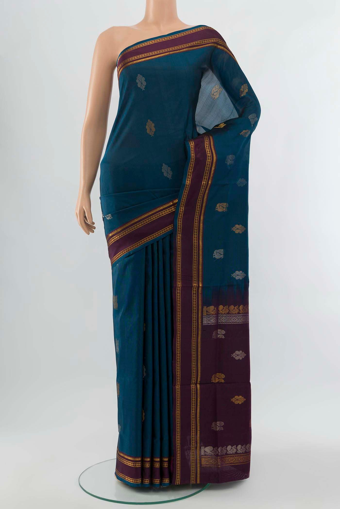 Peacock Blue Uppada Silk Saree with Zari Brocade on the body and Silk Border displayed on a mannequin