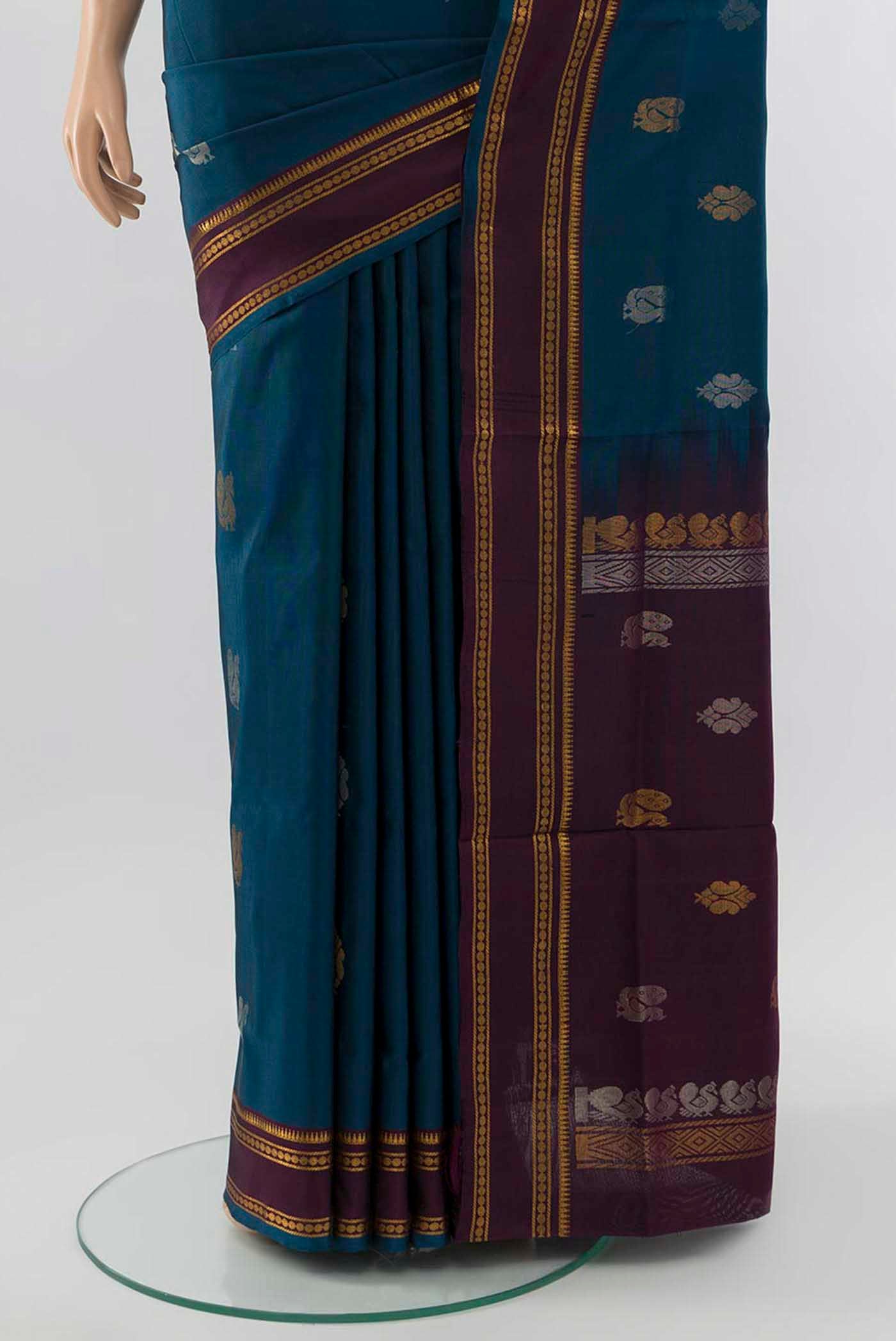 Pleats and pallu of Peacock Blue Uppada Silk Saree with Zari Brocade on the body and Silk Border