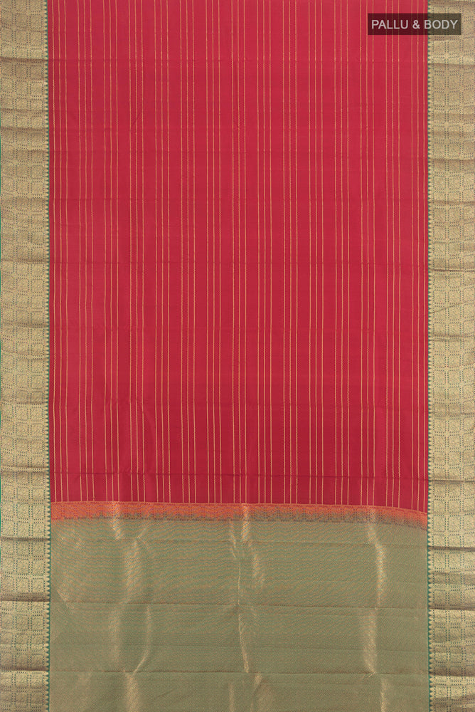 Flat view of Maroon Kanchipuram Silk Saree with Zari Butta on the body and Silk Border. 