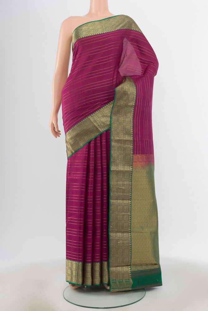 Purple Kanchipuram Silk Saree with Zari Butta on the body and Silk Border.  displayed on a mannequin