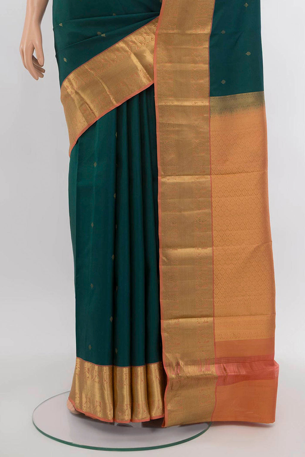 Pleats and pallu of Peacock Blue Kanchipuram Silk Saree with Zari Butta on the body and Silk Border. 