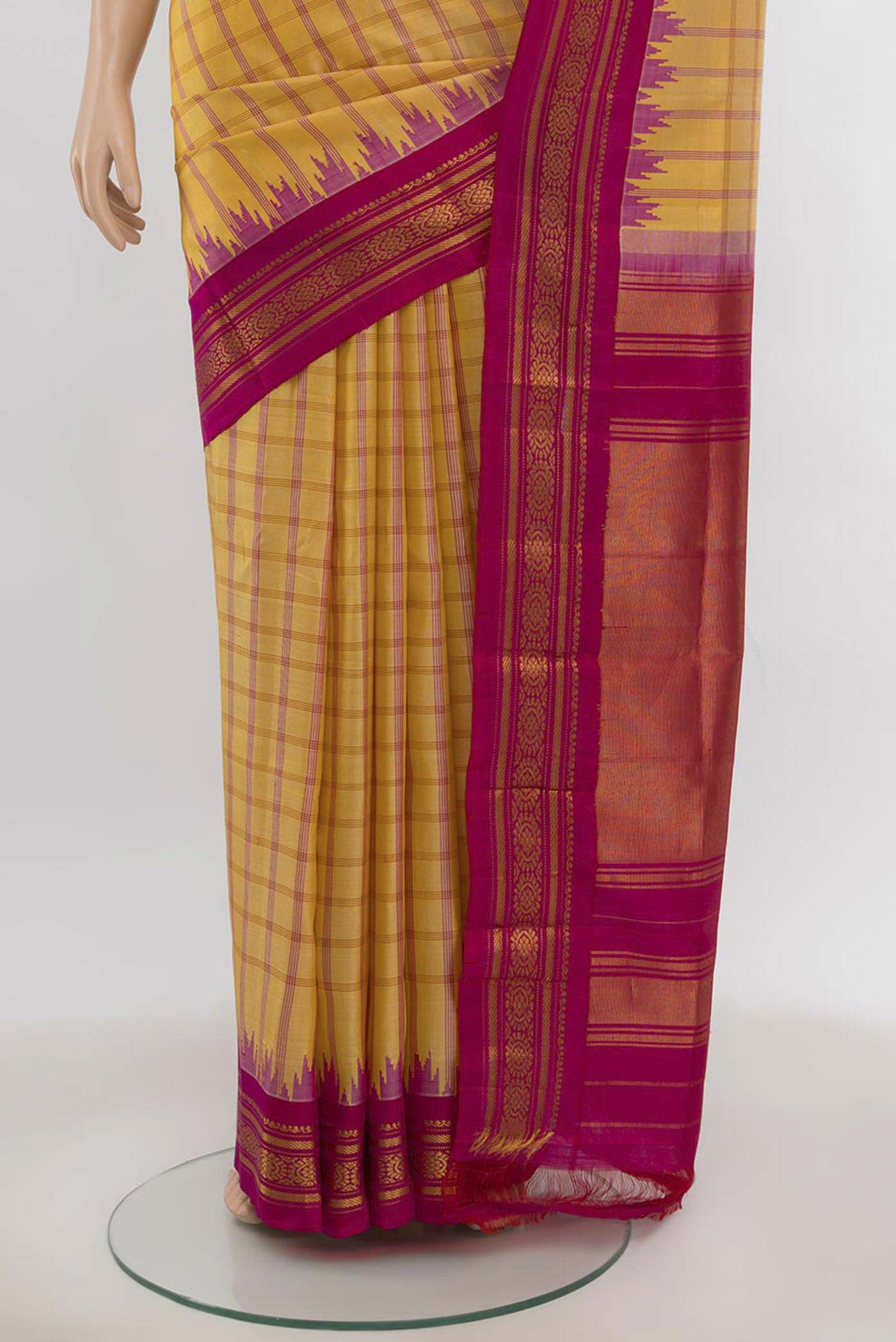 Pleats and pallu of Yellow Gadwal Silk Saree with Zari Butta on the body and Silk Border. 