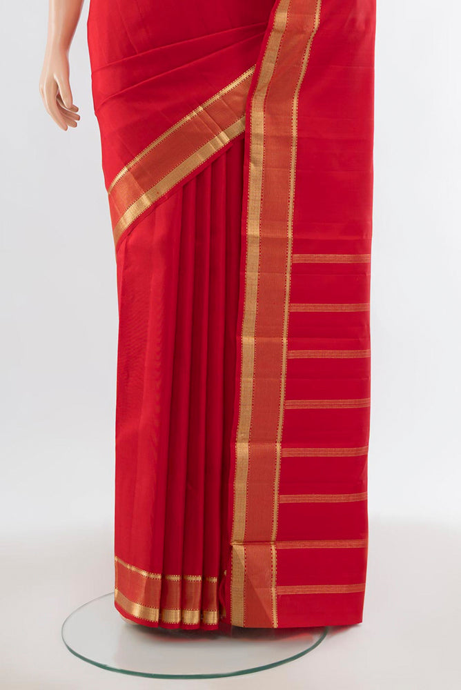 Pleats and pallu of Deep Red Kanjivaram Silk Saree with Zari Butta on the body and Silk Border. 