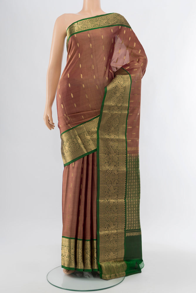 Bronze Kanchipuram Silk Saree with Zari Butta on the body and Silk Border.  displayed on a mannequin