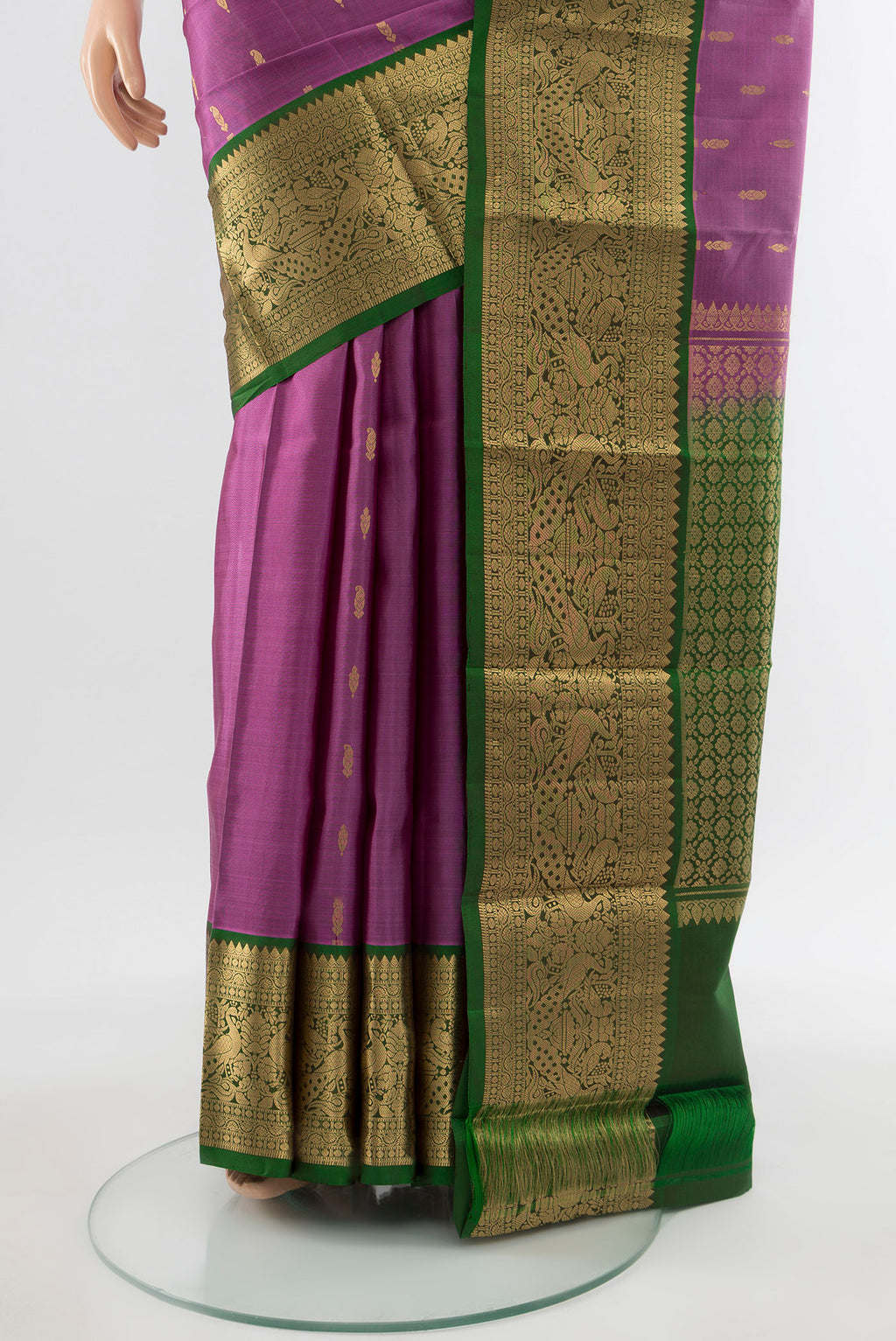 Pleats and pallu of Pure Silk Pure Zari Bronze Kanchipuram Saree with Zari Butta on the body and Silk Border. 