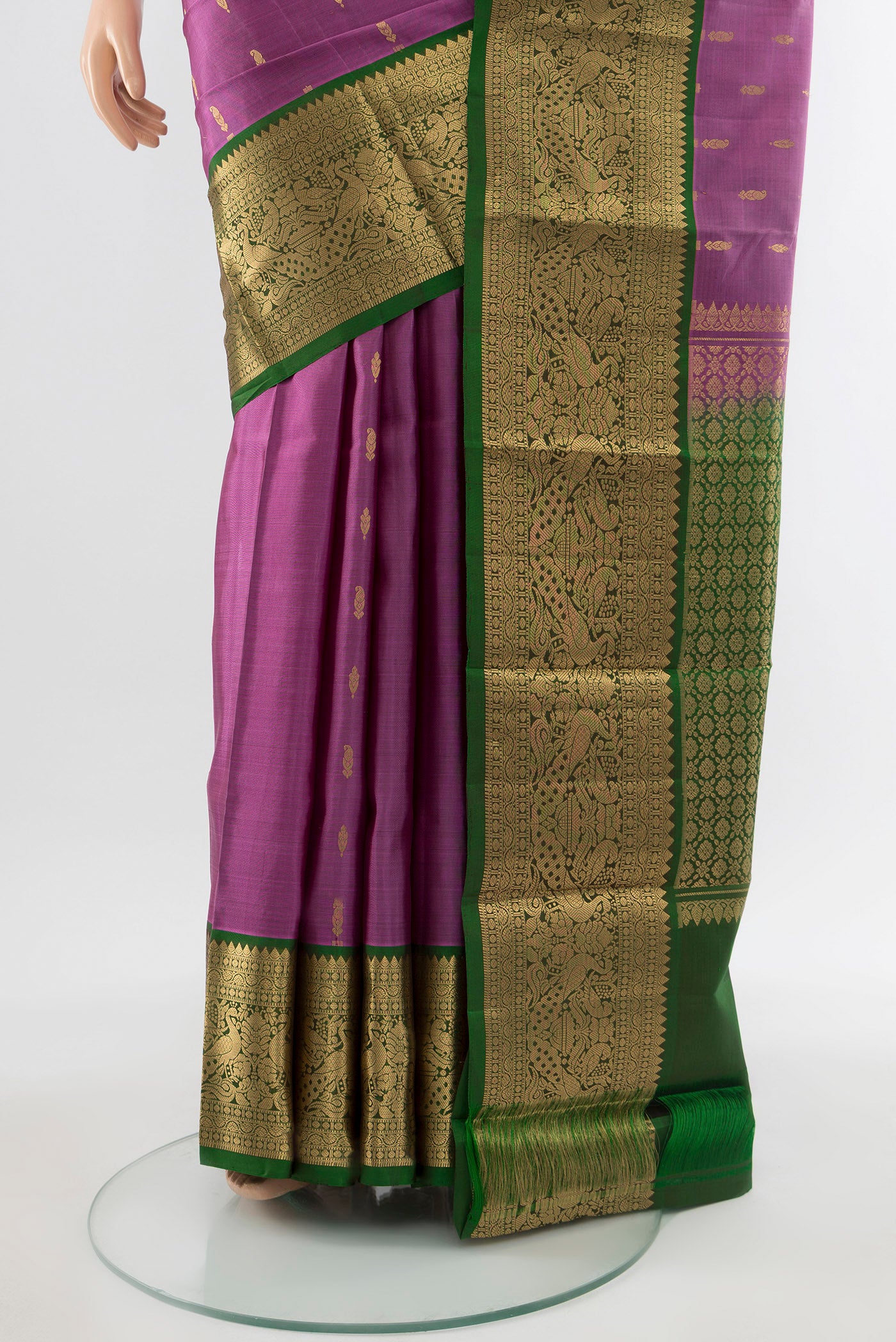 Pleats and pallu of Pure Silk Pure Zari Bronze Kanchipuram Saree with Zari Butta on the body and Silk Border. 