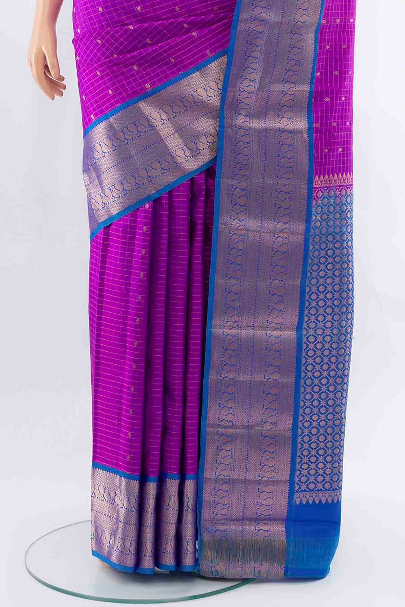 Pleats and pallu of Purple Kanchipuram Silk Saree with Zari Butta on the body and Silk Border