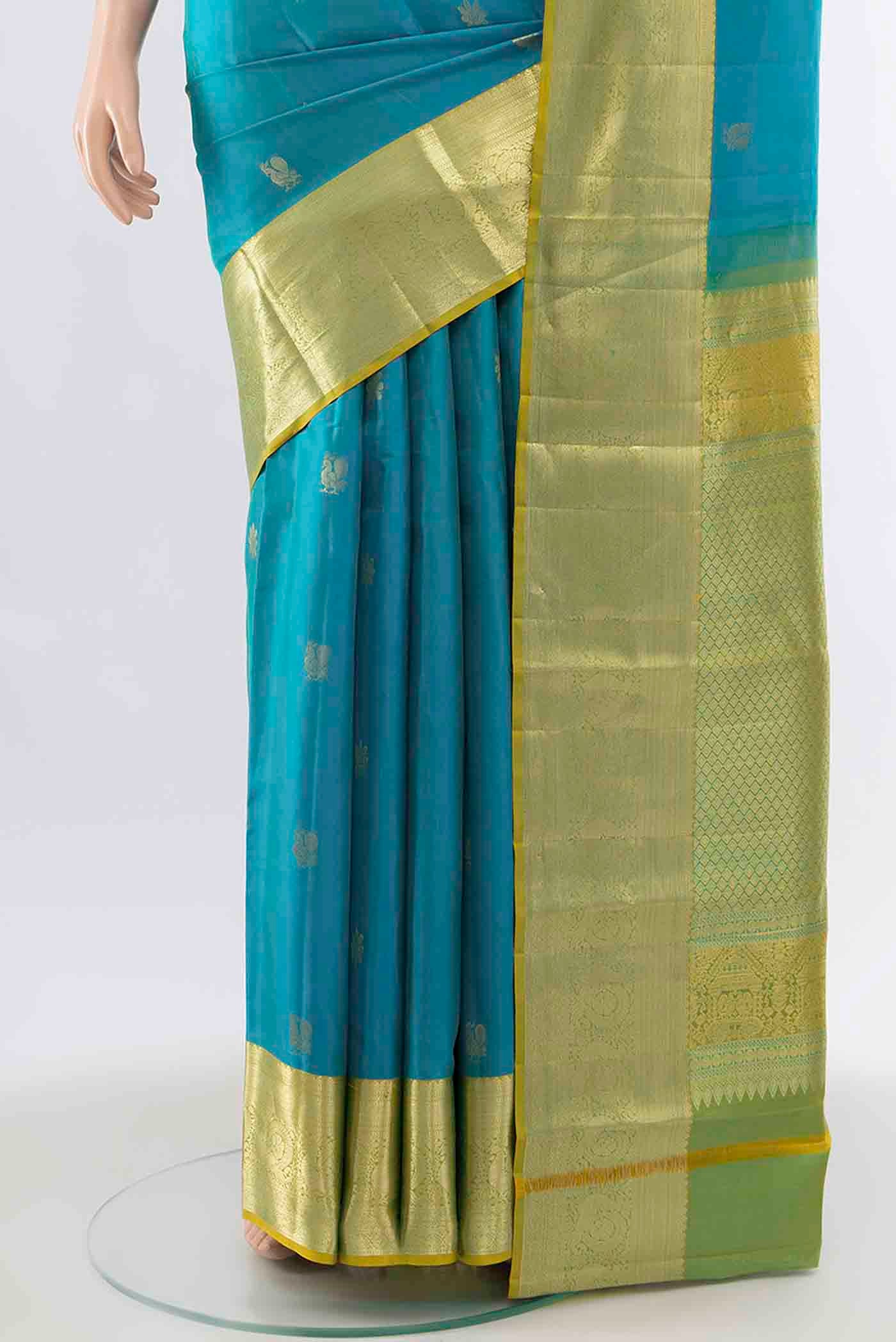 Pleats and pallu of Light Blue Kanchipuram Silk Saree with Zari Butta on the body and Silk Border