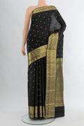 Black Kanchipuram Silk Saree with Zari Butta on the body and Zari Border.  displayed on a mannequin