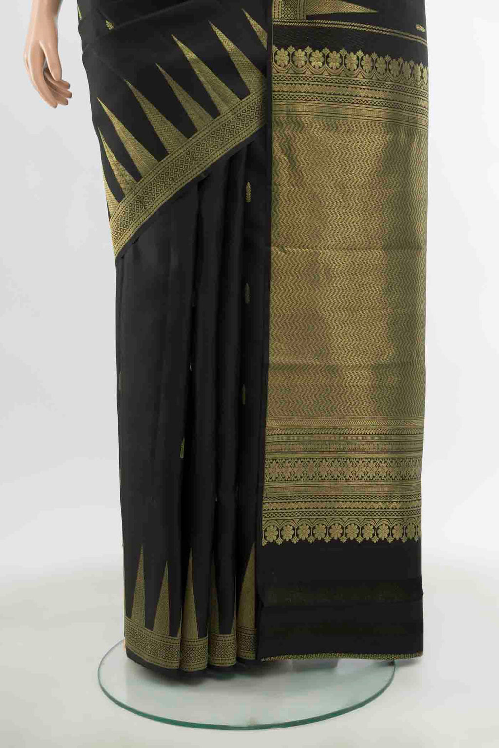 Pleats and pallu of Black Kanchipuram Silk Saree with Zari Butta on the body and Silk Border