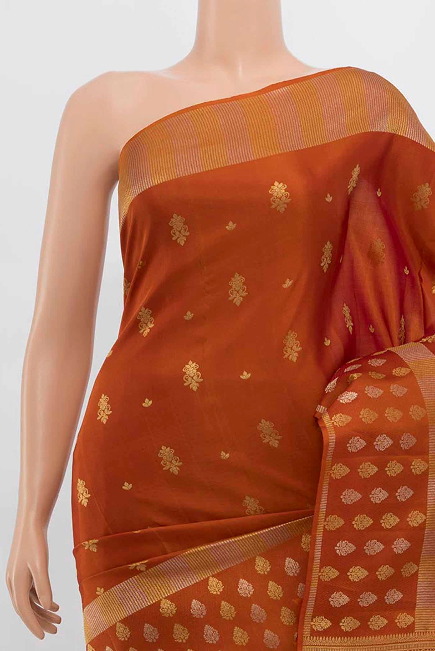 Border image of Rust Kanchipuram Silk Saree with Zari Butta on the body and Silk Border