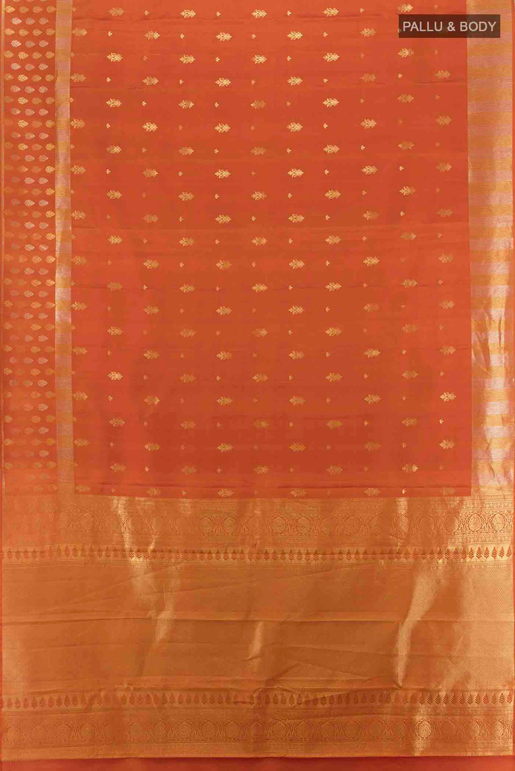 Flat view of Rust Kanchipuram Silk Saree with Zari Butta on the body and Silk Border