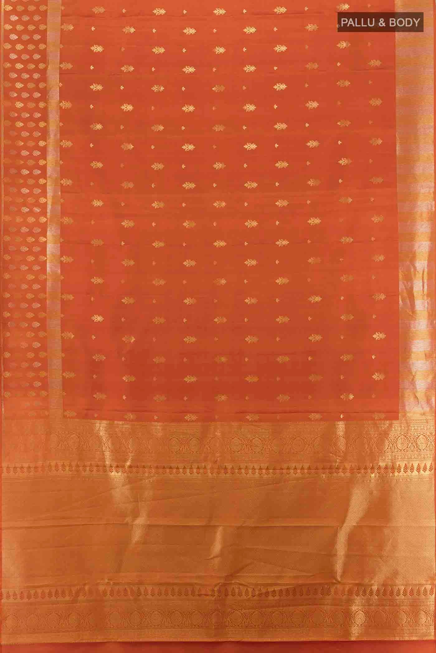 Flat view of Rust Kanchipuram Silk Saree with Zari Butta on the body and Silk Border