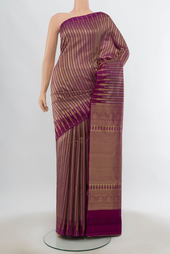 Pure Silk Pure Zari Purple Kanchipuram Saree with Zari Butta on the body and Silk Border.  displayed on a mannequin