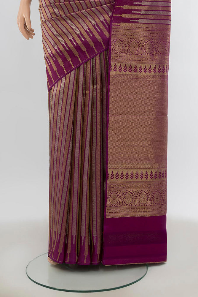 Pleats and pallu of Pure Silk Pure Zari Purple Kanchipuram Saree with Zari Butta on the body and Silk Border. 