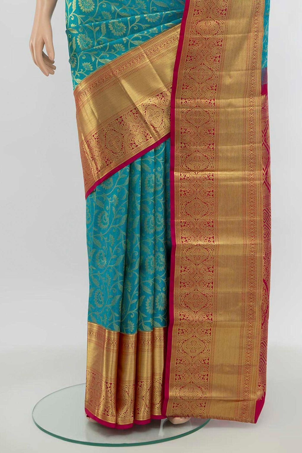 Pleats and pallu of Light Blue Kanchipuram Silk Saree with Zari Butta on the body and Silk Border. 