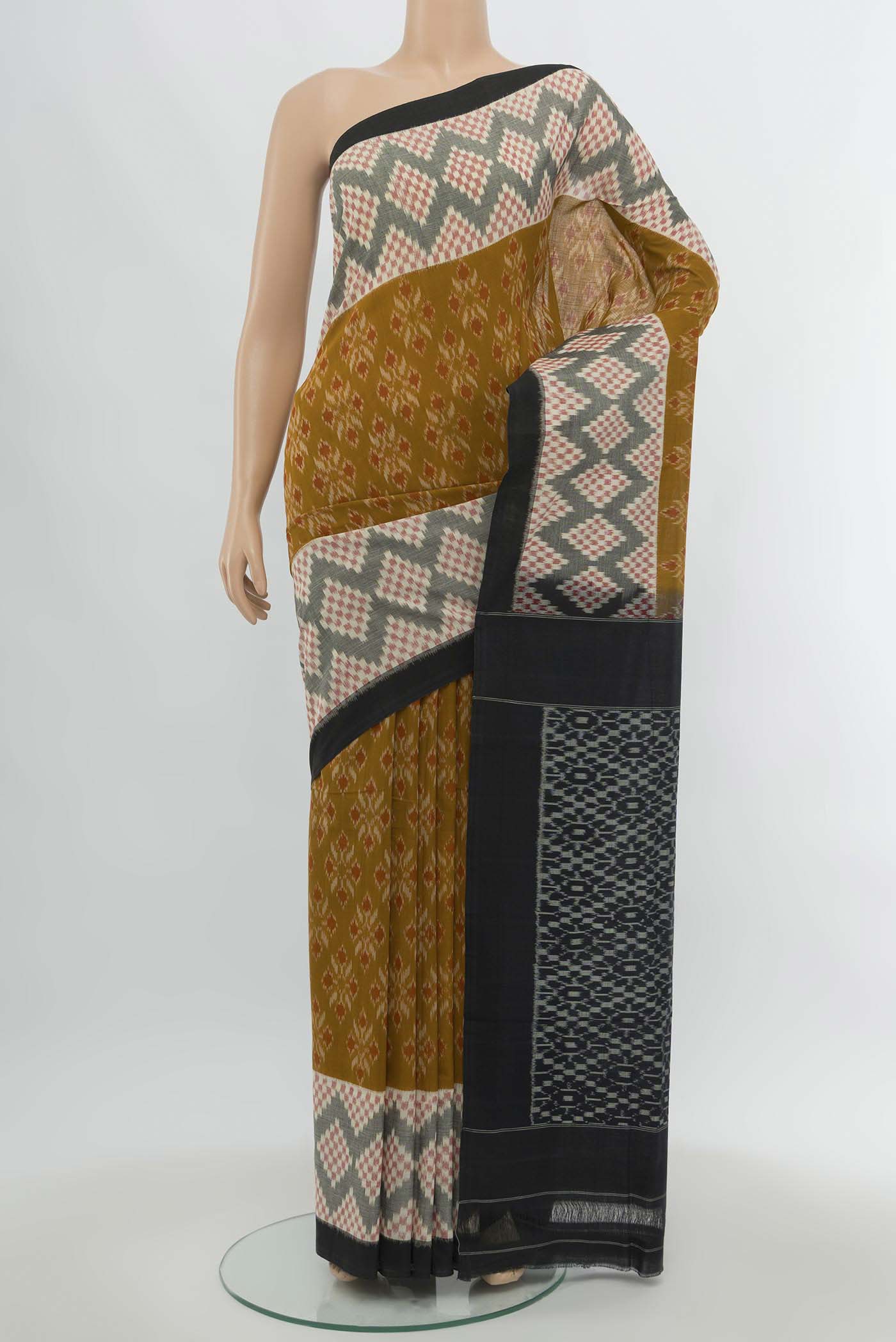 Multi Color Pochampally Cotton Saree with Checked design on the body and Fancy Border.  displayed on a mannequin