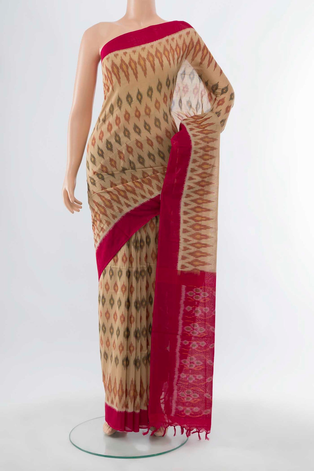 Beige Pochampally Cotton Saree with Ikat Print on the body and Plain Border displayed on a mannequin
