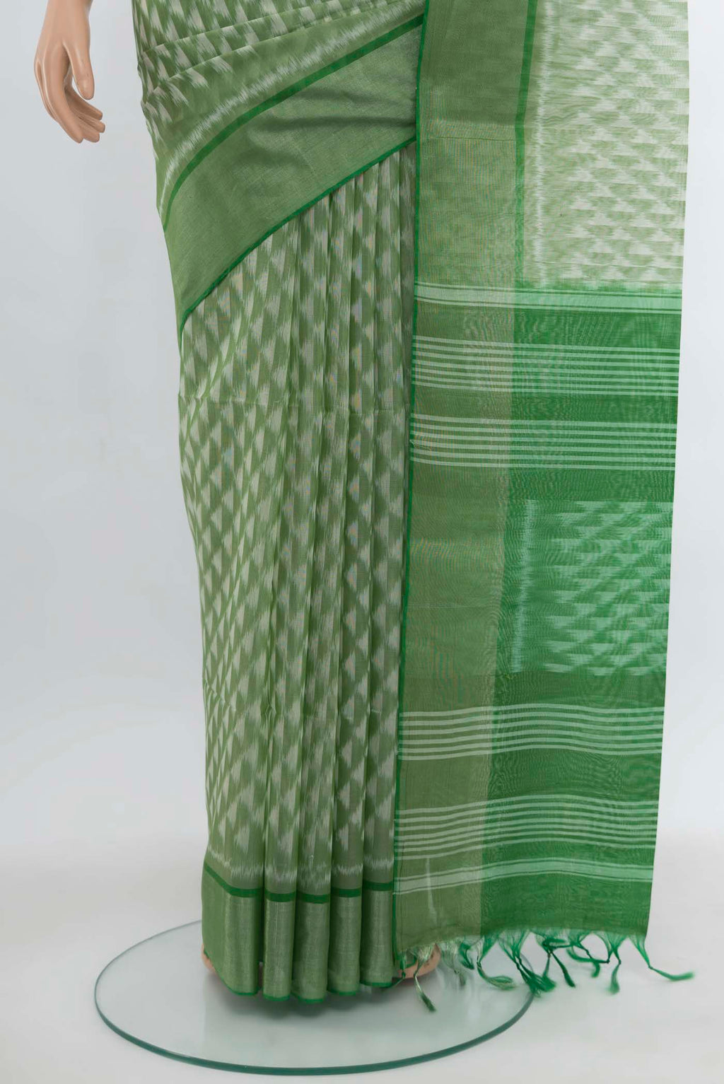 Pleats and pallu of Light Green Kora Cotton Saree with Zari Butta on the body and Silk Border. 