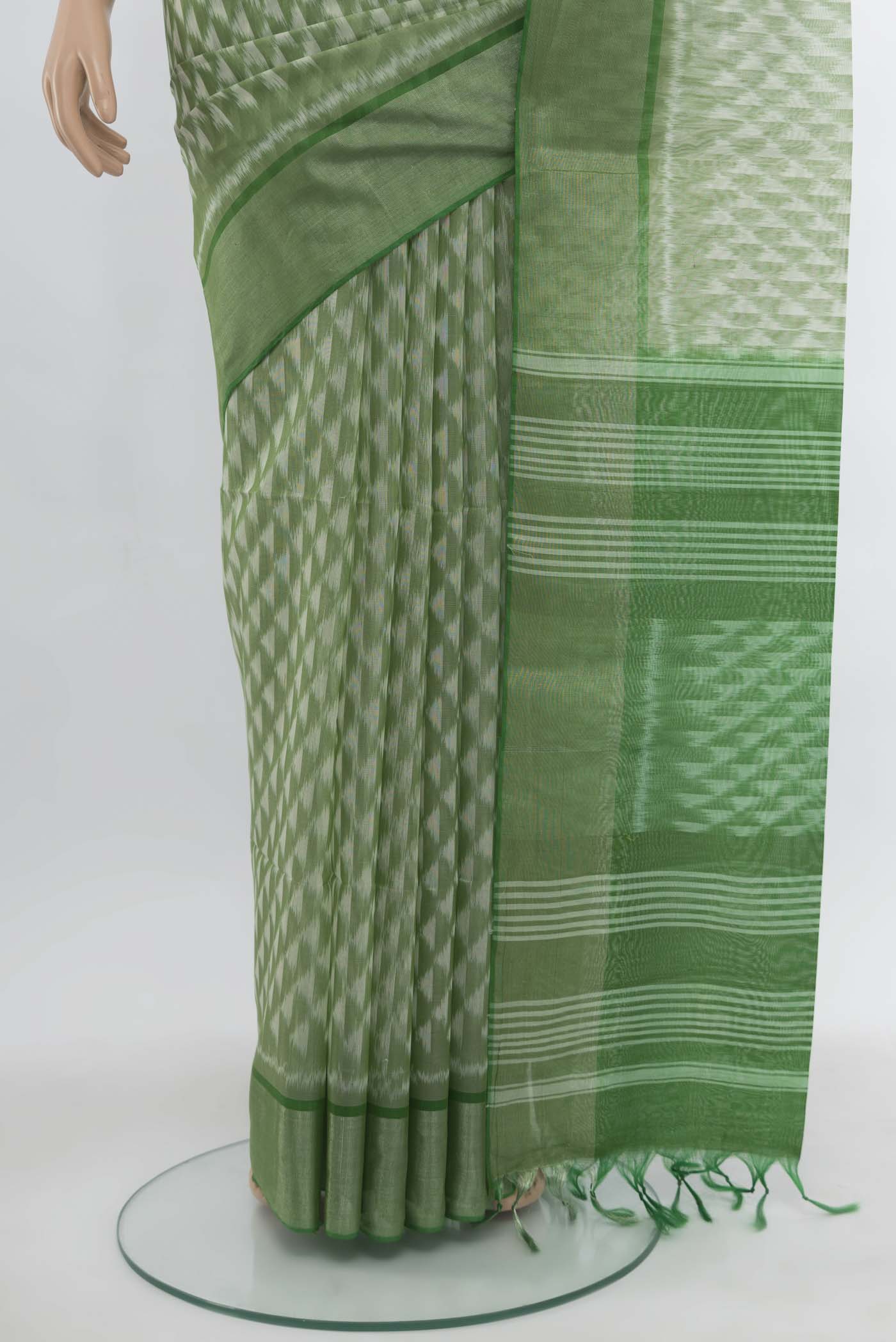 Pleats and pallu of Light Green Kora Cotton Saree with Zari Butta on the body and Silk Border. 