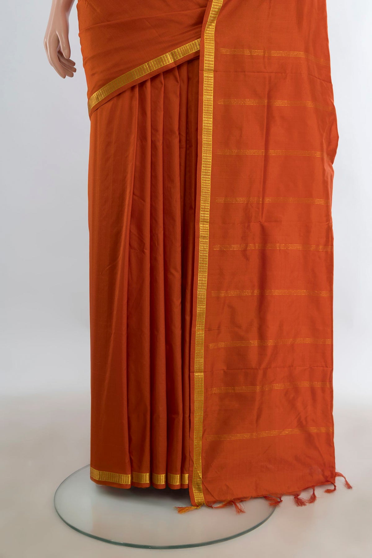 Pleats and pallu of Pure Silk Pure Zari Rust Kanchipuram Nine Yards Saree with Plain Body and Silk Border. 
