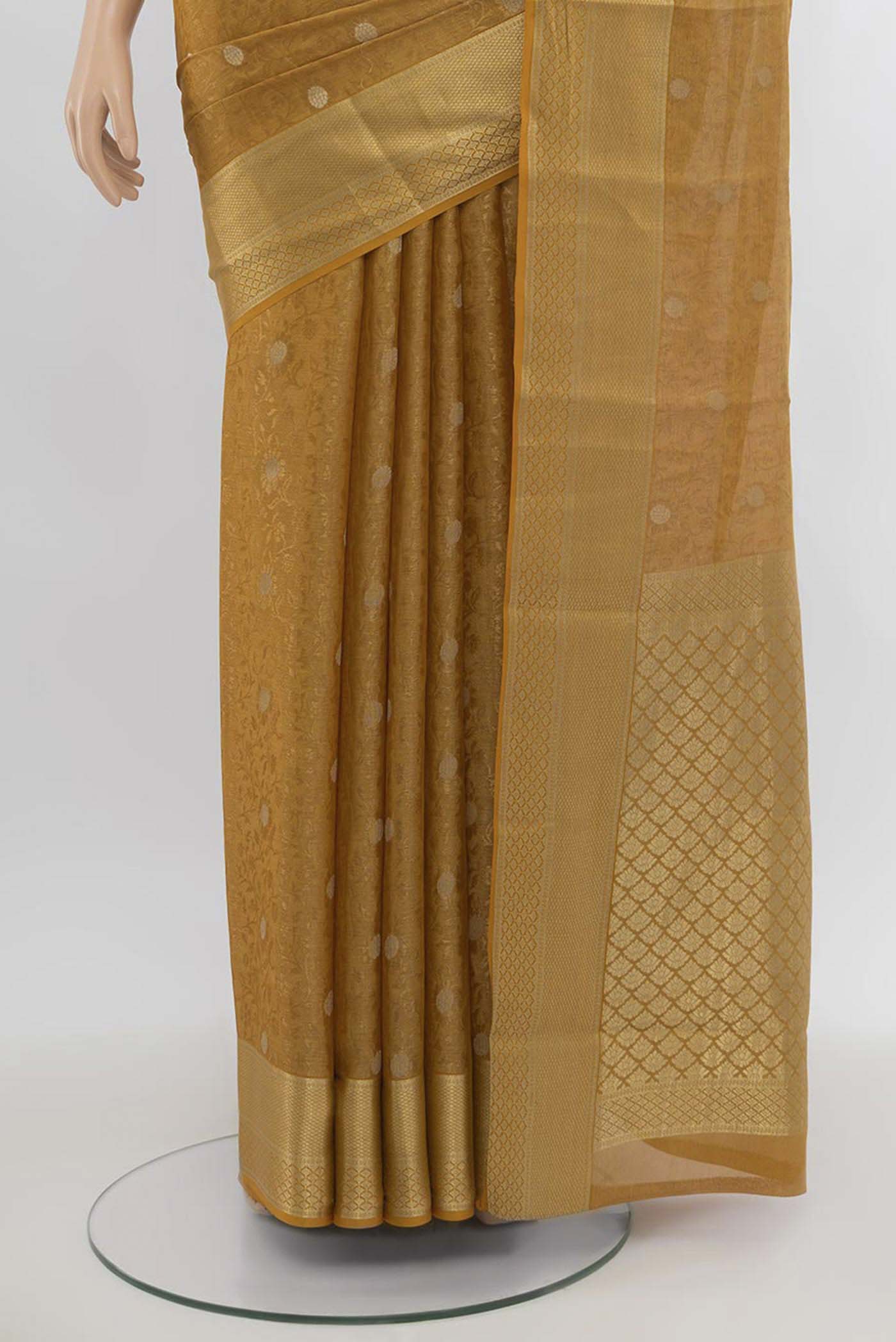 Pleats and pallu of Mustard Mysore Crepe Saree with Zari Butta on the body and Silk Border. 