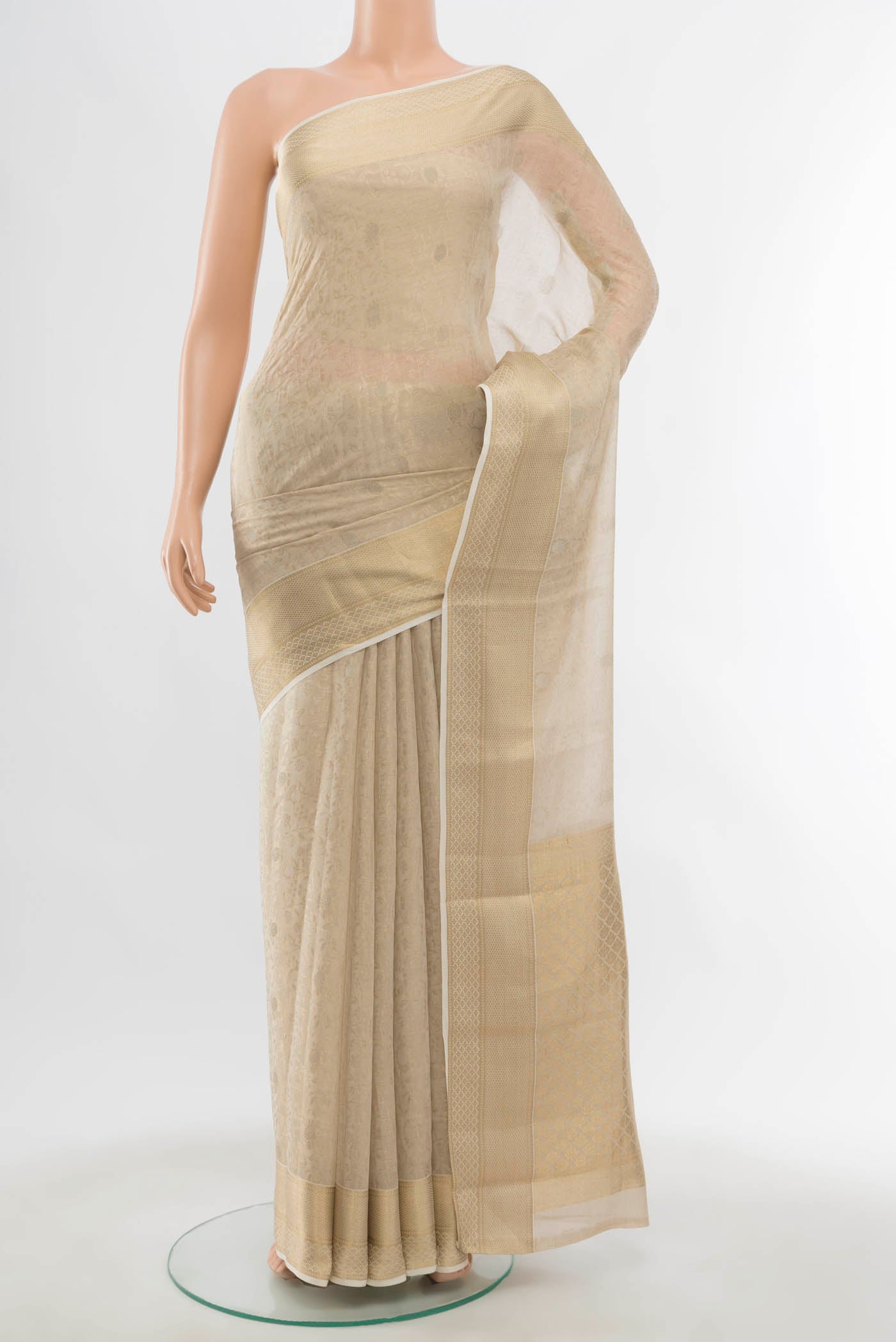 Off White Georgette Saree with Zari Butta on the body and Silk Border displayed on a mannequin