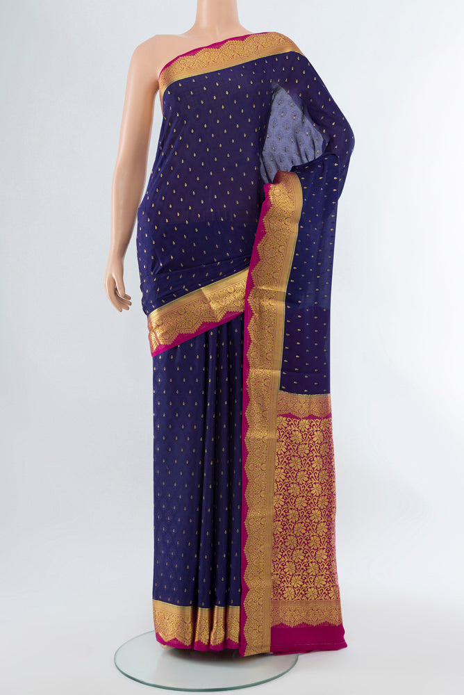Dark Blue Mysore Crepe Saree with Zari Butta on the body and Silk Border.  displayed on a mannequin