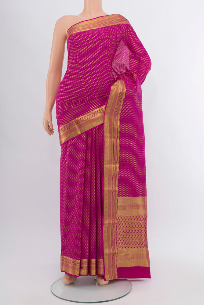 Magenta Mysore Crepe Saree with Zari Butta on the body and Silk Border.  displayed on a mannequin